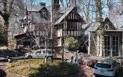 Man explores abandoned mansion in small American town where owner left luxury car collection to rot
