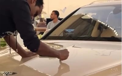 Artist performs live calligraphy on a $200K Bentley at a Qatar festival