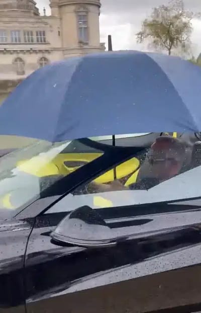 This Bugatti was made for sunshine but someone took it out with a umbrella instead