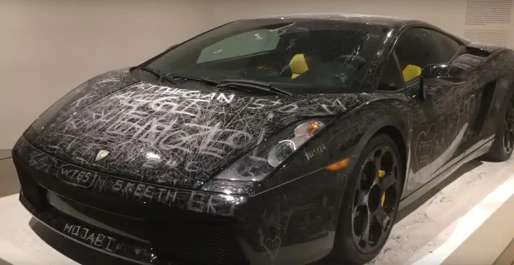 This scratched Lamborghini Gallardo is one of the more...interesting art exhibits that we've seen.