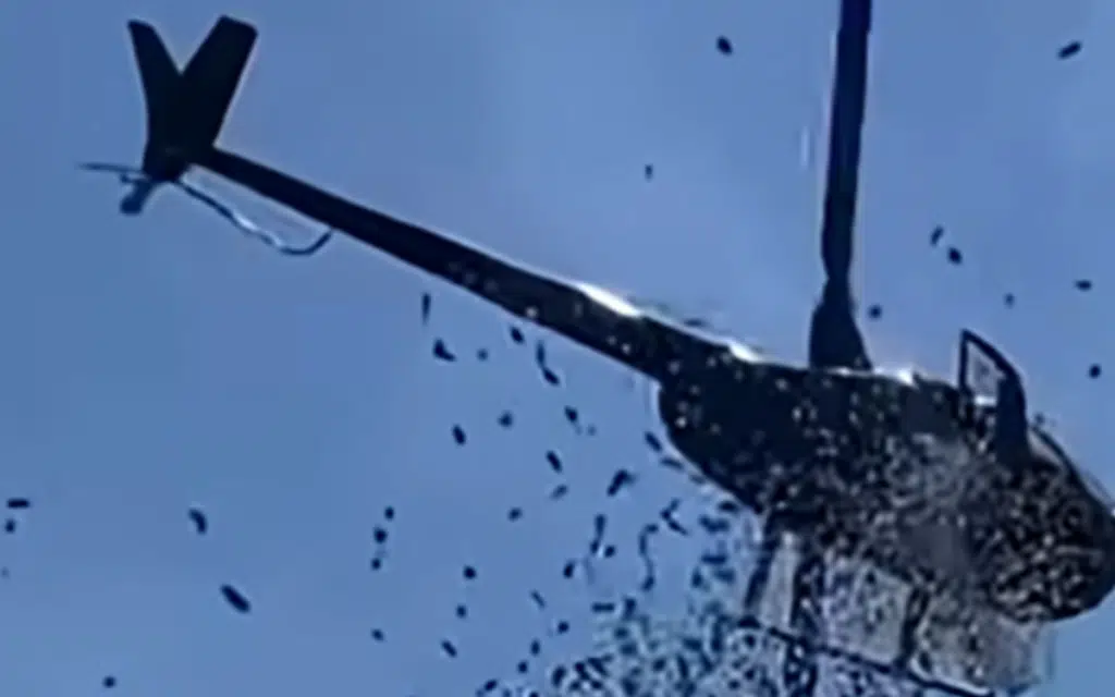 Family of Detroit car wash owner drop $5,000 from a helicopter during funeral for heartwarming reason