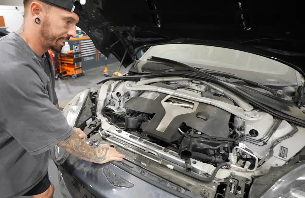 Aston Martin DBX with seized engine from flood damaged car now undergoing a complex engine rebuild after teardown revealed extensive internal damage