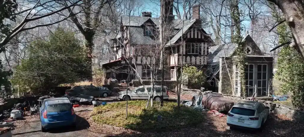 Man explores abandoned mansion in small American town where owner left luxury car collection to rot